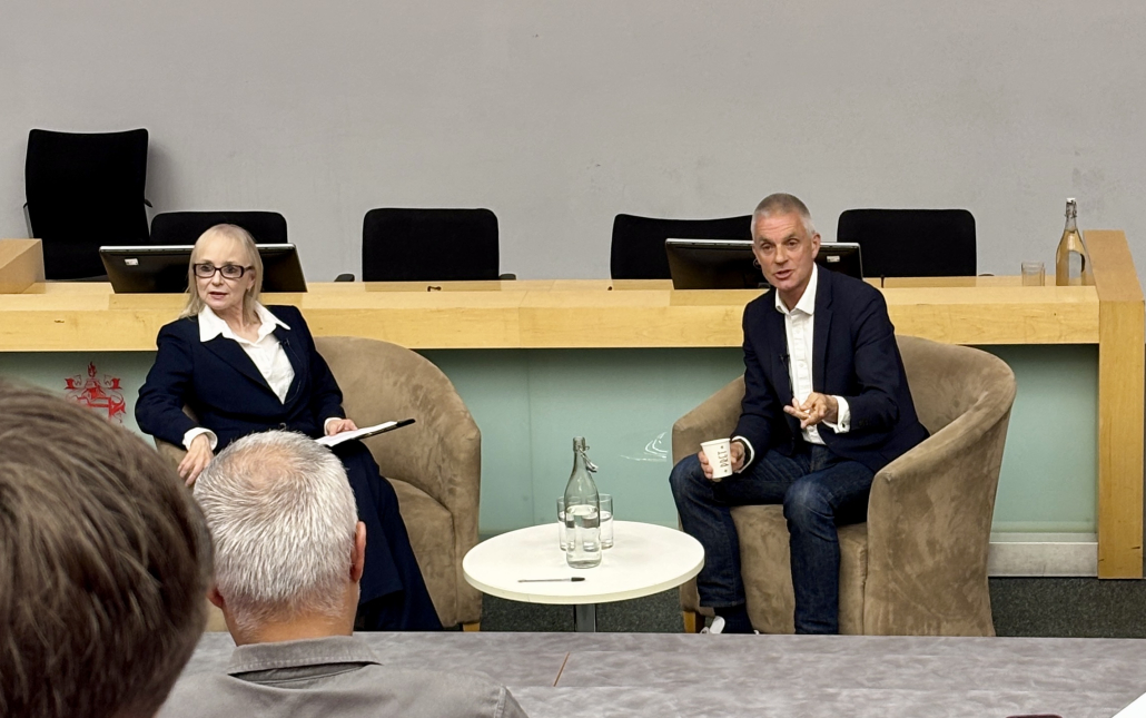 Tim Davie and Juliet John talking to students and staff at City University 